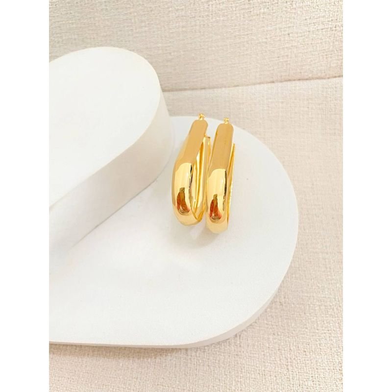 Argola grande oval com tubo largo banhada em ouro 18k