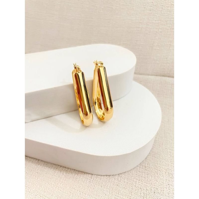 Argola grande oval com tubo largo banhada em ouro 18k